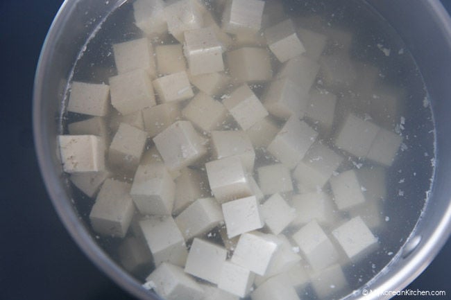 Tofu boiling in a pot of water