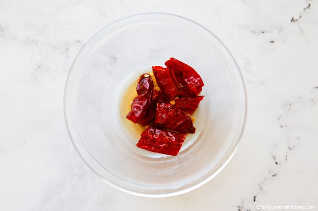 dried chilies soaking in fish sauce for pa kimchi