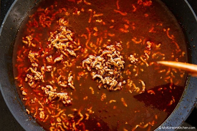 Making the mapo tofu sauce in a skillet