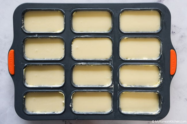 butter tteok batter in a greased baking pan