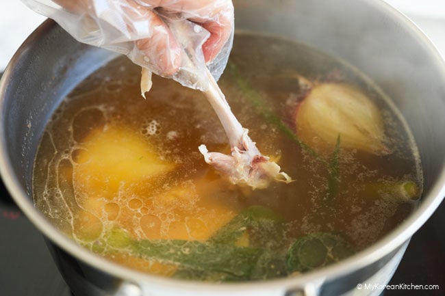 Chicken bones returned to the pot to continue flavoring the broth