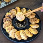 A donggeurangttaeng patty held with chopsticks.